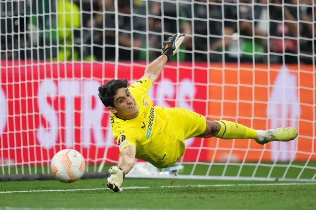 Yassine Bounou of Sevilla FC dives as Roger Ibanez of AS Roma (not pictured) hits the post with the third penalty during the UEFA Europa League 2022/23 final match between Sevilla FC and AS Roma at Puskas Arena on May 31, 2023 in Budapest, Hungary. (Photo by Alex Caparros – UEFA/UEFA via Getty Images)