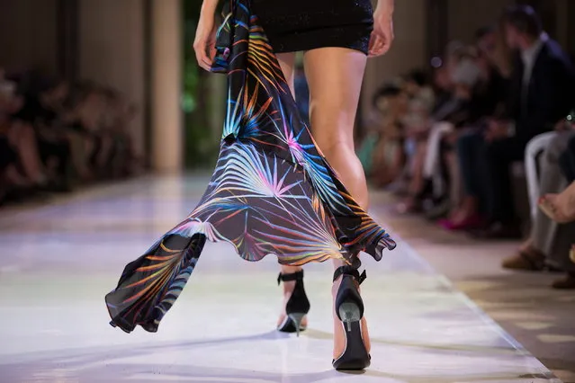 A model presents a creation from the Fall/Winter 2018/19 Haute Couture collection by French designer Maxime Simoens for Azzaro Couture during the Paris Fashion Week, in Paris, France, 01 July 2018. (Photo by Caroline Blumberg/EPA/EFE)