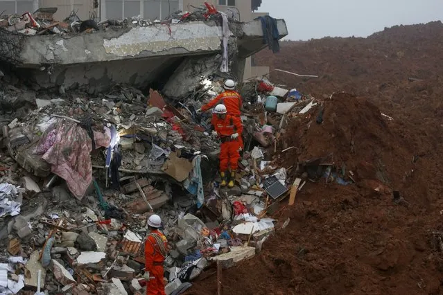 Furniture is pictured among the debris of collapsed buildings after a landslide hit an industrial park in Shenzhen, Guangdong province, China December 20, 2015. (Photo by Tyrone Siu/Reuters)