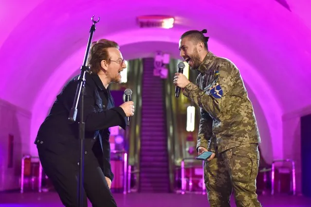 Irish musician Bono (L) of the band U2 performs with Ukrainian singer Taras Topolya (R) from Antytila band, who now serves in the Ukrainian army, in Khreshatyk metro station in Kyiv (Kiev), Ukraine, 08 May 2022, to support Ukraine in the conflict with Russia. Western countries have responded with various sets of sanctions against Russian state majority owned companies and interests in a bid to bring an end to the conflict. Russian troops entered Ukraine on 24 February, resulting in fighting and destruction in the country. (Photo by Oleg Petrasyuk/EPA/EFE)