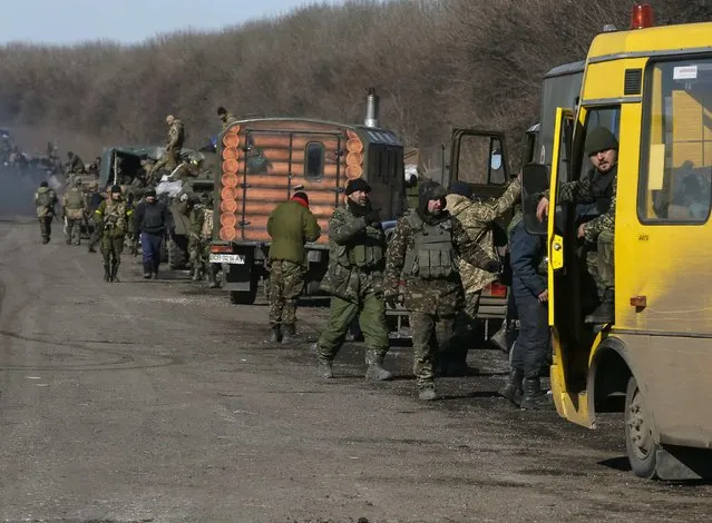 Ukrainian servicemen are seen near Artemivsk as they leave an area around Debaltseve, eastern Ukraine February 18, 2015. (Photo by Gleb Garanich/Reuters)