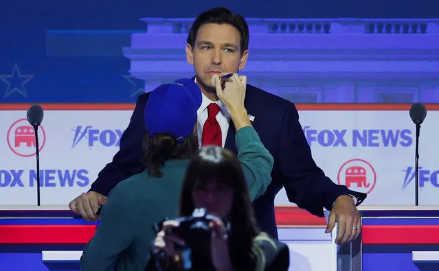 Republican presidential candidate Florida Governor Ron DeSantis gets his makeup touched up during a commercial break at the first Republican candidates' debate of the 2024 U.S. presidential campaign in Milwaukee, Wisconsin, U.S. August 23, 2023. (Photo by Brian Snyder/Reuters)
