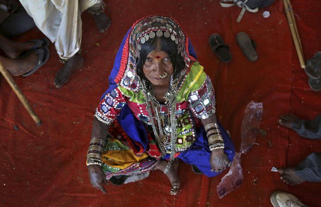 Ramavva Lamani, an indigenous Indian woman, looks at the camera as she joins a protest by backward Hindu communities demanding equal rights in Bangalore, India, Wednesday, February 11, 2015. Ancient and deep-rooted patterns of caste discrimination in India have denied tribals and other backward communities economic, education and social rights. (Photo by Aijaz Rahi/AP Photo)