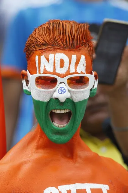 Fans cheer on their team from the stands during game three of the One Day International series between India and Australia at Saurashtra Cricket Association Stadium on September 27, 2023 in Rajkot, India. (Photo by Pankaj Nangia/Getty Images)