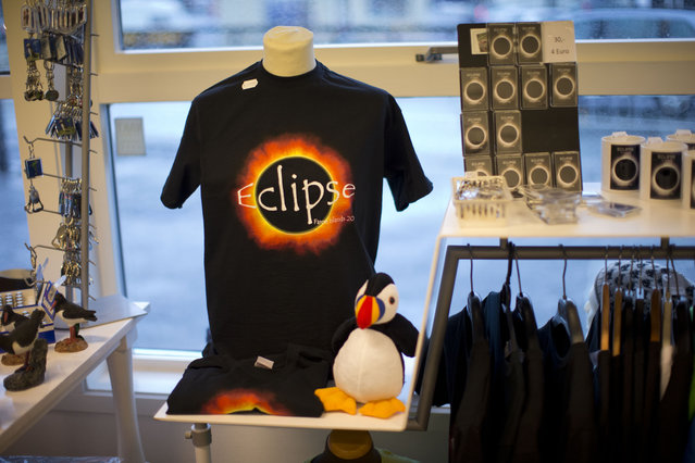 A T-shirt and other items of eclipse merchandise are displayed for sale in a store in Torshavn, the capital city of the Faeroe Islands, Thursday, March 19, 2015. For months, even years, accommodation on the remote Faeroe Islands has been booked out by fans who don't want to miss an almost three-minute-long astronomical sensation. (Photo by Matt Dunham/AP Photo)