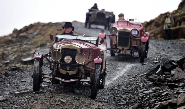 Vintage sports car enthusiasts spend the weekend powering their way up a 2,126ft fell in the Lake District as part of an annual pilgrimage to Honister Slate Mine, racing cars from the 1920s and 1930s.Over 100 vehicles scaled Fleetwith Pike in Cumbria in adverse weather conditions. (Photo by Owen Humphreys/PA Wire)