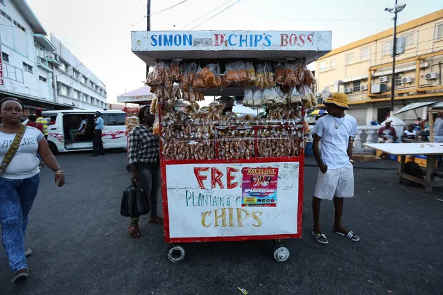 A snack food vendor is pictured in the market in Georgetown, Guyana, November 30,  2016. (Photo by Carlo Allegri/Reuters)