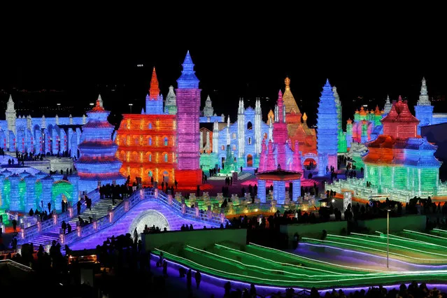 Ice sculptures illuminated by colored lights are seen at annual ice festival, in the northern city of Harbin, Heilongjiang province, China January 4, 2019. (Photo by Tyrone Siu/Reuters)