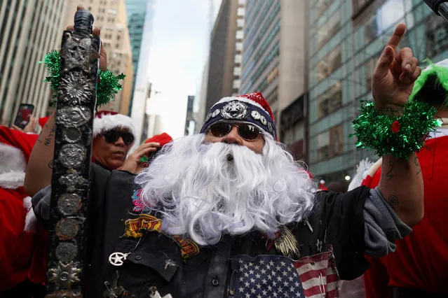 A reveller takes part in SantaCon in New York City, New York, U.S., December 9, 2023. (Photo by David Dee Delgado/Reuters)