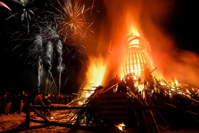 Fireworks go off while the beetle goes up in flames after being set on fire during the 11th annual Burning Beetle event on Saturday, January 20, 2024, at Pageant Park in Custer, S.D. The event was created in response to the Mountain Pine Beetle infestation a few years ago and continues to bring awareness to the impact of the beetles. (Photo by Matt Gade/Rapid City Journal via AP Photo)