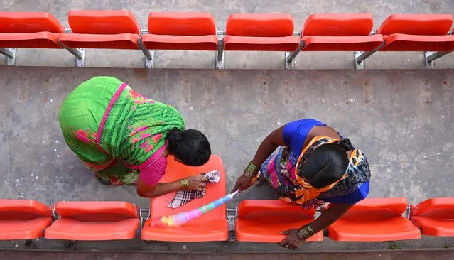Workers pictured cleaning the seats at Rajiv Gandhi International Stadium on January 24, 2024 ahead of the first test match against England in Hyderabad, India. (Photo by Stu Forster/Getty Images)
