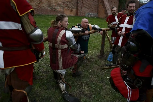 Fighters from Denmark take a break during the Medieval Combat World Championship at Malbork Castle, northern Poland, April 30, 2015. (Photo by Kacper Pempel/Reuters)