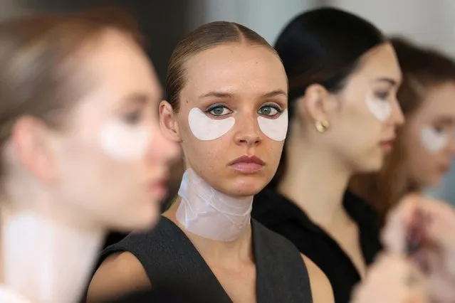 Models are prepared backstage before the Badgley Mischka Fall/Winter 2024 collection show at New York Fashion Week, in New York City, U.S., February 10, 2024. (Photo by Andrew Kelly/Reuters)