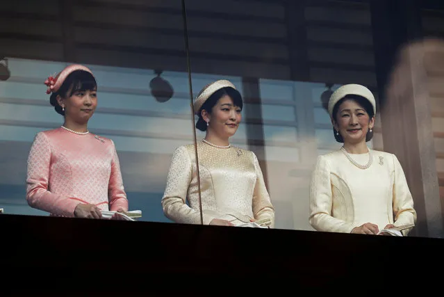 Japan's Crown Princess Kiko and her daughters Princess Mako and Princess Kako greet well-wishers during a public appearance at the Imperial Palace in Tokyo, Japan on May 4, 2019. (Photo by Issei Kato/Reuters)
