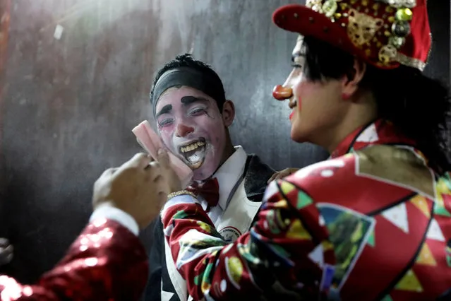 Clowns prepare to take part in a parade during Peru's Clown Day celebrations in Lima, Peru on May 25, 2019. (Photo by Guadalupe Pardo/Reuters)