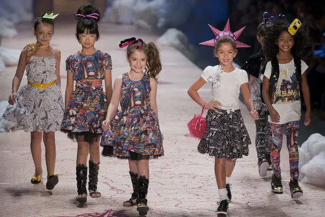 Children wear outfits from the children's brand Lilica Ripilica during the Sao Paulo Fashion Week in Sao Paulo, Brazil, Thursday, April 3, 2014. (Photo by Andre Penner/AP Photo)