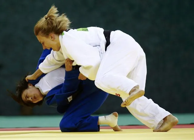 Charline van Snick (R) of Belgium and Ebru Sahin of Turkey fight during their women's 48kg judo gold medal fight at the 1st European Games in Baku, Azerbaijan, June 25 , 2015. (Photo by Kai Pfaffenbach/Reuters)