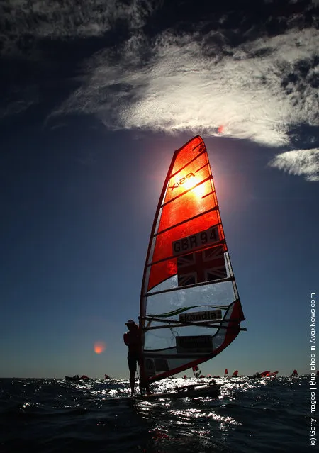 Bryony Shaw of Great Britain waits for the fourth race in the RS:X Womens Windsurfer Blue fleet on the Centre course during day three of the 2011 ISAF Sailing World Championships