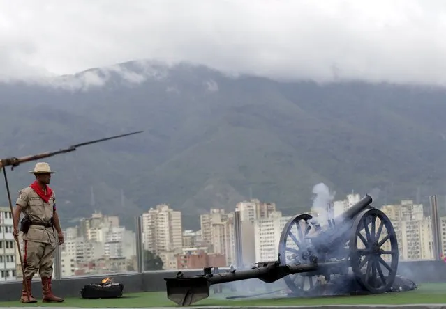 A cannon fires at 4:25 p.m., the time the death of Venezuela's late president Hugo Chavez was announced, at the 4F military fort in Caracas, June 30, 2015. (Photo by Jorge Dan Lopez/Reuters)