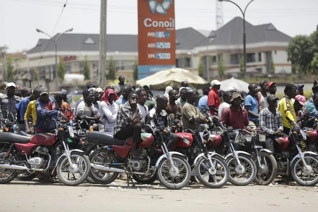 In this photo taken Sunday April 10, 2016, motorcycles wait for fuel at the petrol station in Abuja, Nigeria. Nigeria's government announced Wednesday May 11, 2016 it is lifting a controversial subsidy on gas, nearly doubling the price amid a massive fuel shortage and militant attacks on oil installations in Africa's biggest petroleum producer. (Photo by Sunday Alamba/AP Photo)