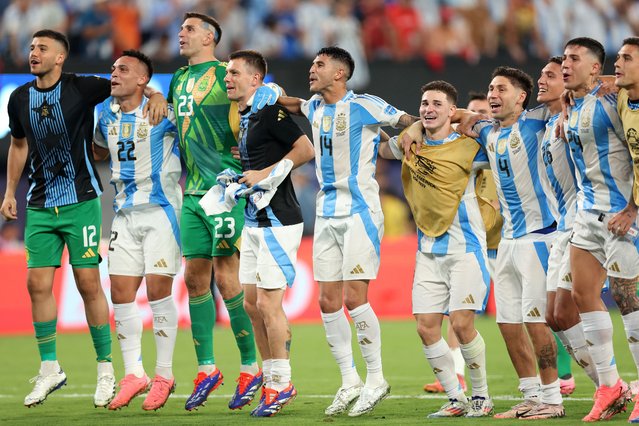 Argentina's players celebrate their team's victory in the Conmebol 2024 Copa America tournament semi-final football match between Argentina and Canada at MetLife Stadium, in East Rutherford, New Jersey on July 9, 2024. (Photo by Charly Triballeau/AFP Photo)