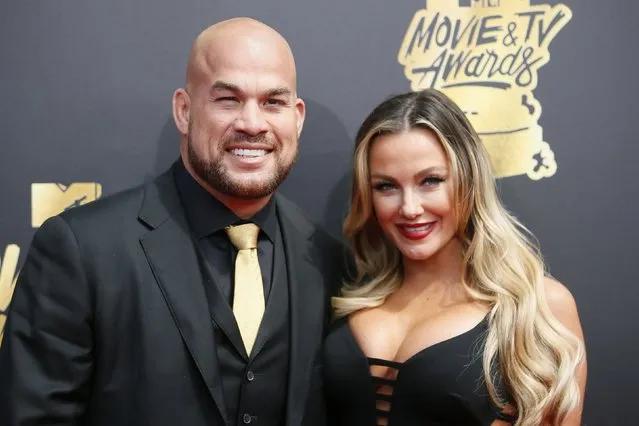 MMA fighter Tito Ortiz (L) and Amber Nichole Miller attend the 2017 MTV Movie And TV Awards at The Shrine Auditorium on May 7, 2017 in Los Angeles, California. (Photo by Danny Moloshok/Reuters)