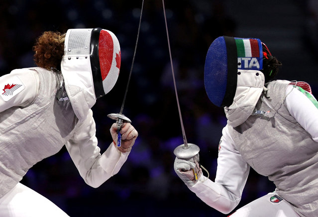 Alice Volpi of Italy in action with Eleanor Harvey of Canada during the women's fencing foil individual bronze medal bout on July 28, 2024. (Photo by Maye-E Wong/Reuters)