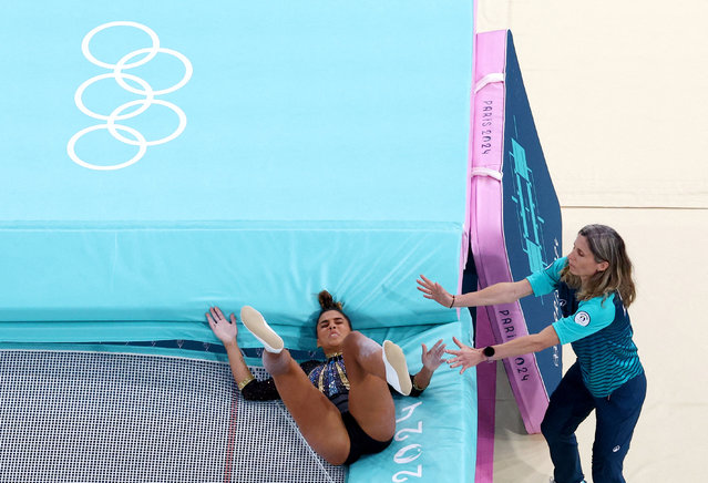 Malak Hamza of Egypt reacts after falling during the women's trampoline qualifications on August 2, 2024. (Photo by Athit Perawongmetha/Reuters)