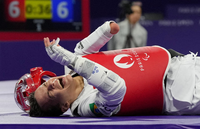 Nathan Torquato of Brazil reacts against Mahmut Bozteke of Turkey during men's K44 63kg taekwondo semifinal in Paris, France on August 30, 2024. (Photo by Maja Smiejkowska/Reuters)