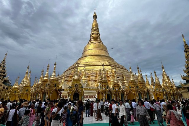 Devotees visit Shwedagon Pagoda as Buddhists mark Buddha's Birthday, which falls on the Full Moon Day of Kasone, in Yangon on May 22, 2024. Thousands of Buddhist devotees gathered at Myanmar's Shwedagon Pagoda on May 22 to mark the Buddha's birthday and to water a sacred Bodhi tree to mark a full moon festival. (Photo by Sai Aung Main/AFP Photo)