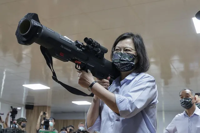 This handout picture taken and released by Taiwan’s Presidential Office on June 2, 2022, shows Taiwanese President Tsai Ing-wen holding an anti-tank rocket device while visiting a military base in Taoyuan. (Photo by Taiwan's Presidential Office/Handout via AFP Photo)
