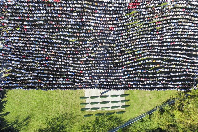 Mourners gather as they attend the collective funeral for 19 victims of a landslide caused by recent floods in Jablanica, Bosnia, Tuesday, October 15, 2024. (Photo by Armin Durgut/AP Photo)