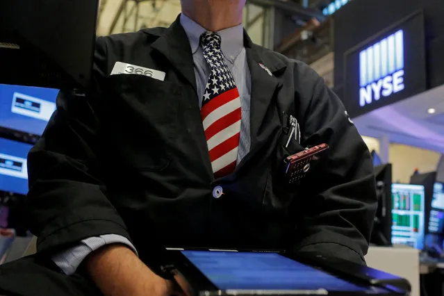 A trader works on the floor at the New York Stock Exchange (NYSE) ahead of the July 4 holiday weekend in New York City, New York, U.S., July 1, 2016. (Photo by Andrew Kelly/Reuters)