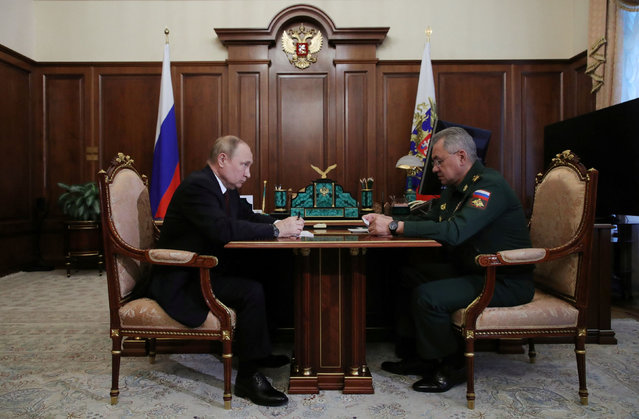 Russian President Vladimir Putin meets with Defence Minister Sergei Shoigu at the Kremlin in Moscow on July 4, 2022. (Photo by Mikhail Klimentyev/Sputnik/AFP Photo)