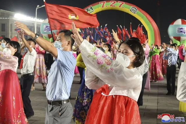 In this photo provided by the North Korean government, youth gather to celebrate the 69th anniversary of the signing of the ceasefire armistice that ends the fighting in the Korean War, is held in Pyongyang, North Korea Wednesday, July 27, 2022. (Photo by Korean Central News Agency/Korea News Service via AP Photo)