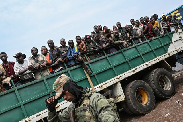 M23 rebels escort government soldiers and police who surrendered to an undisclosed location in Goma, Democratic Republic of the Congo, Thursday, January 30, 2025. (Photo by Moses Sawasawa/AP Photo)