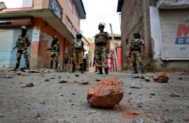 Stones thrown by protestors litter the street in Srinagar as security forces enforce a curfew following weeks of violence in Kashmir, August 18, 2016. (Photo by Cathal McNaughton/Reuters)