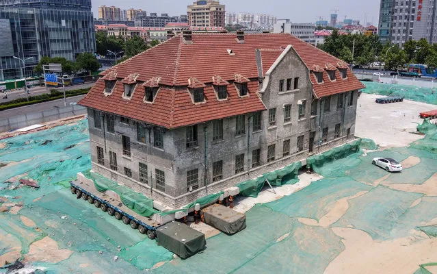 A Nun House of about 100 years old is on a hydraulic module trailer ready for translational moving in Jinan city, east China's Shandong province on June 8, 2020. (Photo by Rex Features/Shutterstock)