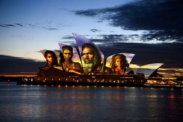 The sails of the Sydney Opera House are illuminated with an artwork by Aboriginal digital artist Brett Leavy, which represents and celebrates Aboriginal history, culture and people, as part of Dawn Reflection on Australia Day in Sydney, Australia, 26 January 2024. (Photo by Dan Himbrechts/EPA)