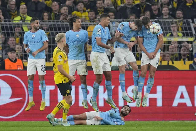 Dortmund's defensive wall blocks a free kick of Dortmund's Thorgan Hazard during the Champions League Group G soccer match between Borussia Dortmund and Manchester City in Dortmund, Germany, Tuesday, October 25, 2022. (Photo by Martin Meissner/AP Photo)