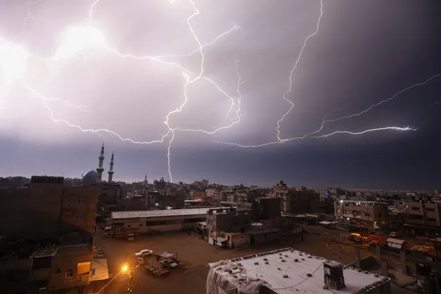 A picture taken on January 16, 2020 shows lightnings over Rafah in the southern Gaza Strip during heavy rains. (Photo by Said Khatib/AFP Photo)