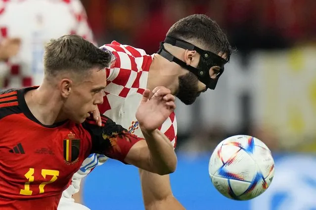 Belgium's Leandro Trossard, left, and Croatia's Josko Gvardiol fight for the ball during the World Cup group F soccer match between Croatia and Belgium at the Ahmad Bin Ali Stadium in Al Rayyan, Qatar, Thursday, December 1, 2022. (Photo by Luca Bruno/AP Photo)