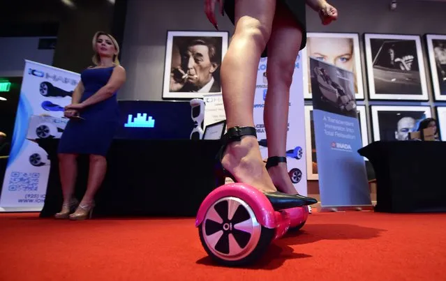 Katelynn Nunez  rides on the IO Hawk Intelligent Personal Mobility Device at The Luxury Technology Show, produced by RAND Luxury, an international event production company that caters to the world's finest luxury brands on September 30, 2015 in Hollywood, California. (Photo by Frederic J. Brown/AFP Photo)