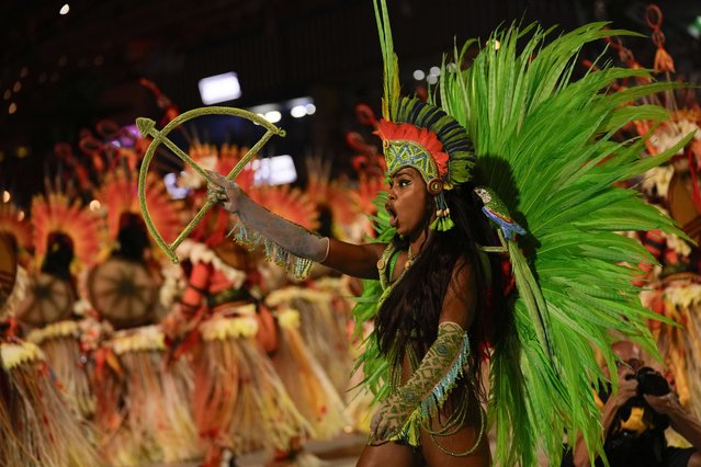 A performer from the Salgueiro samba school parades during Carnival celebrations at the Sambadrome in Rio de Janeiro, Brazil, Monday, February 12, 2024. (Photo by Silvia Izquierdo/AP Photo)