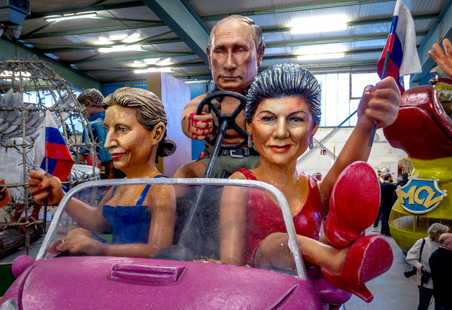 A carnival float with a figure depicting Russian President Vladimir Putin, center, is presented during a press preview for the Mainz carnival in Mainz, Germany, Tuesday, February 6, 2024. At left head of German AfD party (Alternative for Germany) Alice Weidel, at right Sarah Wagenknecht who recently founded her own party BSW (Alliance Sahra Wagenknecht). (Photo by Michael Probst/AP Photo)