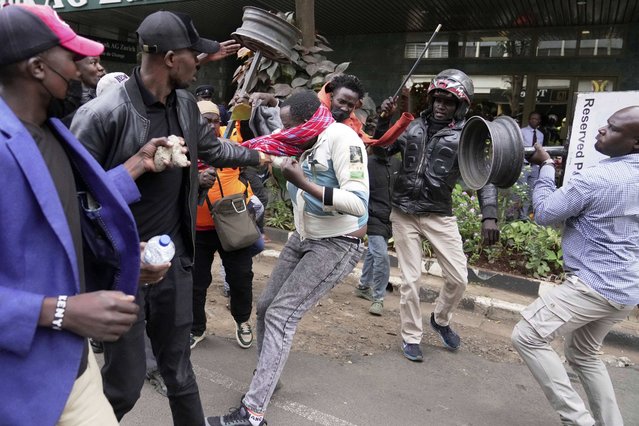 A suspected pro government supporter is attacked by protesters during a demonstration over the death of blogger Albert Ojwang in police custody, in downtown Nairobi, Kenya, Tuesday, June 17, 2025. (Photo by Brian Inganga/AP Photo)