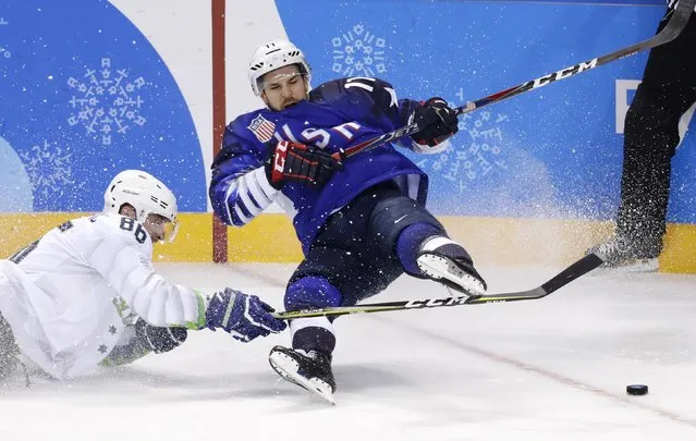 Slovenia's Sabahudin Kovacevic falls in the men's preliminary round ice hockey match between the US and Slovenia during the Pyeongchang 2018 Winter Olympic Games at the Kwandong Hockey Centre in Gangneung on February 14, 2018. (Photo by David W. Cerny/Reuters)