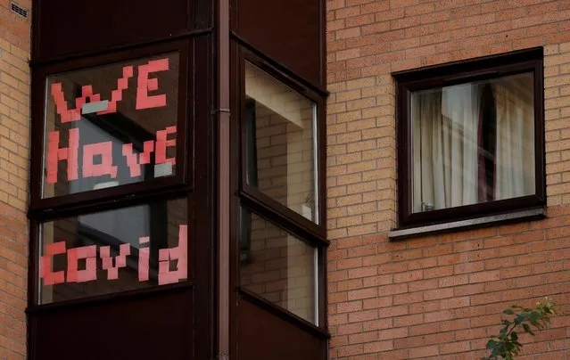 A sign is displayed in the window of a student accommodation building following the outbreak of the coronavirus disease (COVID-19) in Manchester, Britain, October 5, 2020. (Photo by Phil Noble/Reuters)