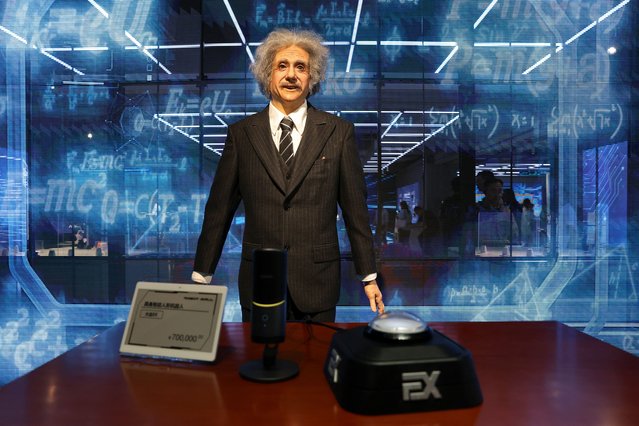 A humanoid robot in the likeness of late physicist Albert Einstein stands behind a price tag, during an organised media tour to Robot Mall, a store selling humanoid and other robots, in Beijing, China on August 6, 2025. (Photo by Florence Lo/Reuters)