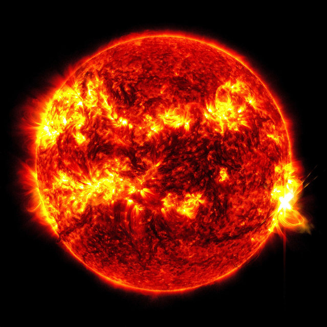 This image provided by NASA's Solar Dynamics Observatory shows a solar flare, the bright flash at right, on Tuesday, May 14, 2024. The sun produced its biggest flare in nearly a decade Tuesday, just days after a severe solar storm pummeled Earth and created dazzling northern lights in unaccustomed places. (Photo by NASA/SDO via AP Photo)